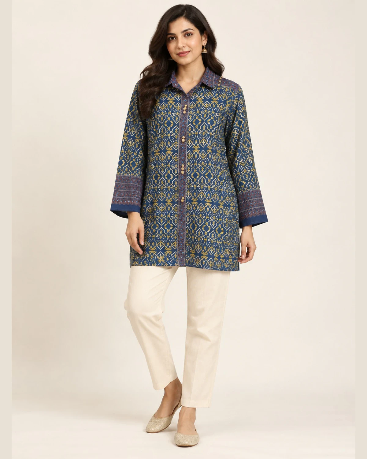 Woman wearing an indigo and plum trellis print shirt kurti with cream trousers