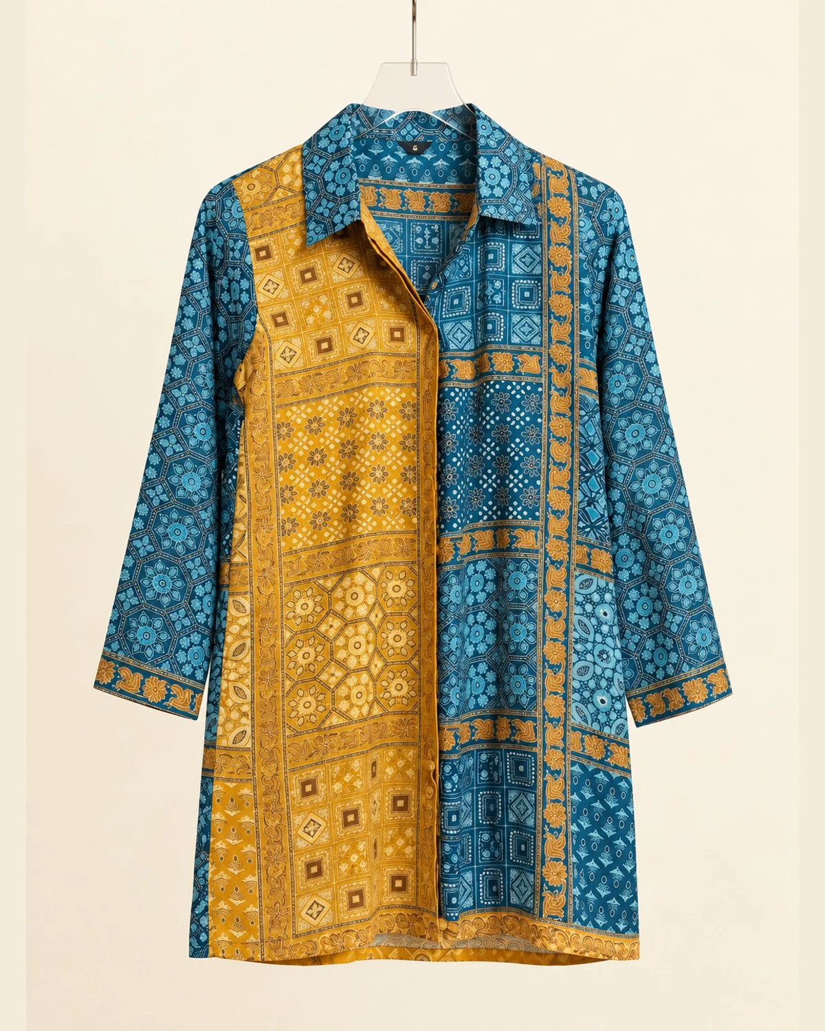 Teal and mustard geometric print crepe shirt kurti on a hanger, front view