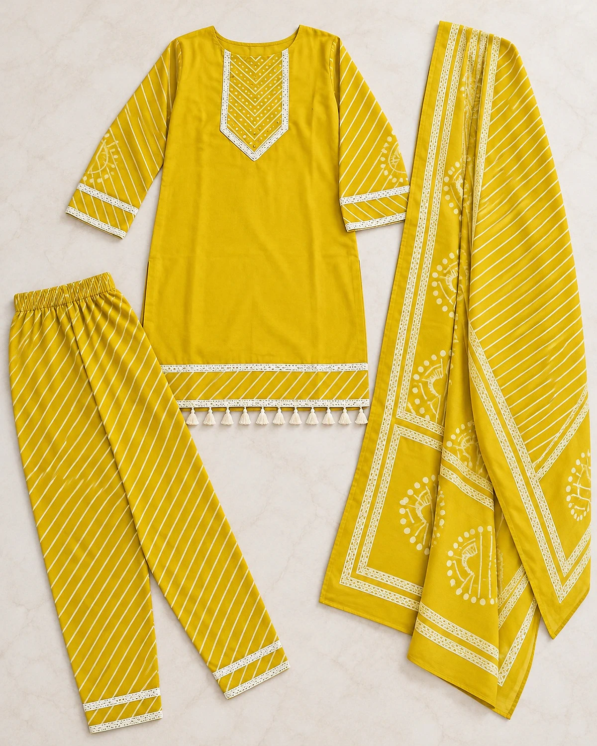 Yellow kurta, trousers and dupatta laid out flat