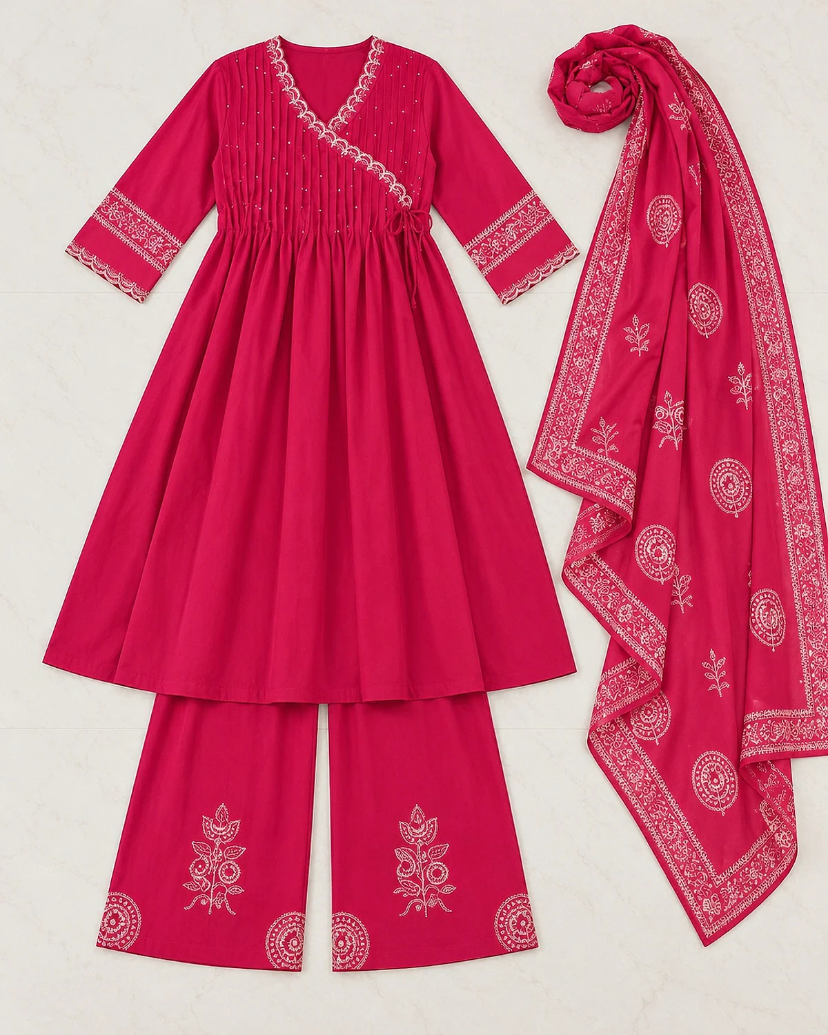 Fuchsia kurta, palazzo and dupatta laid out flat