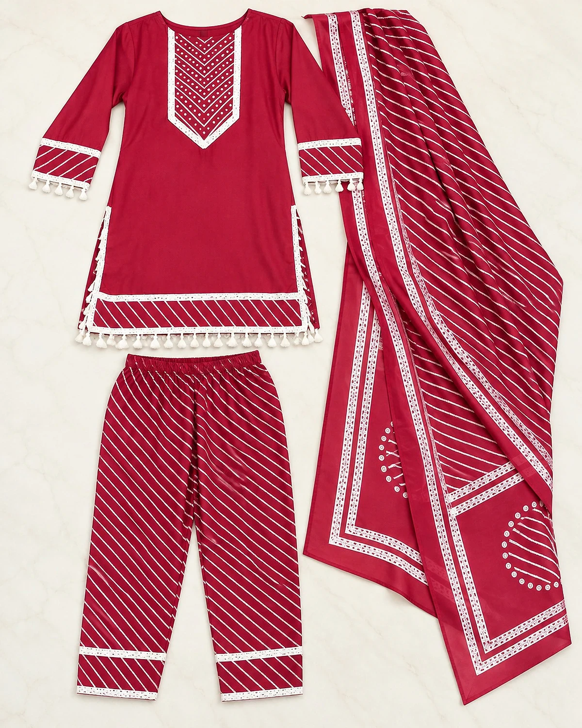 Maroon red kurta, trousers and dupatta laid out flat