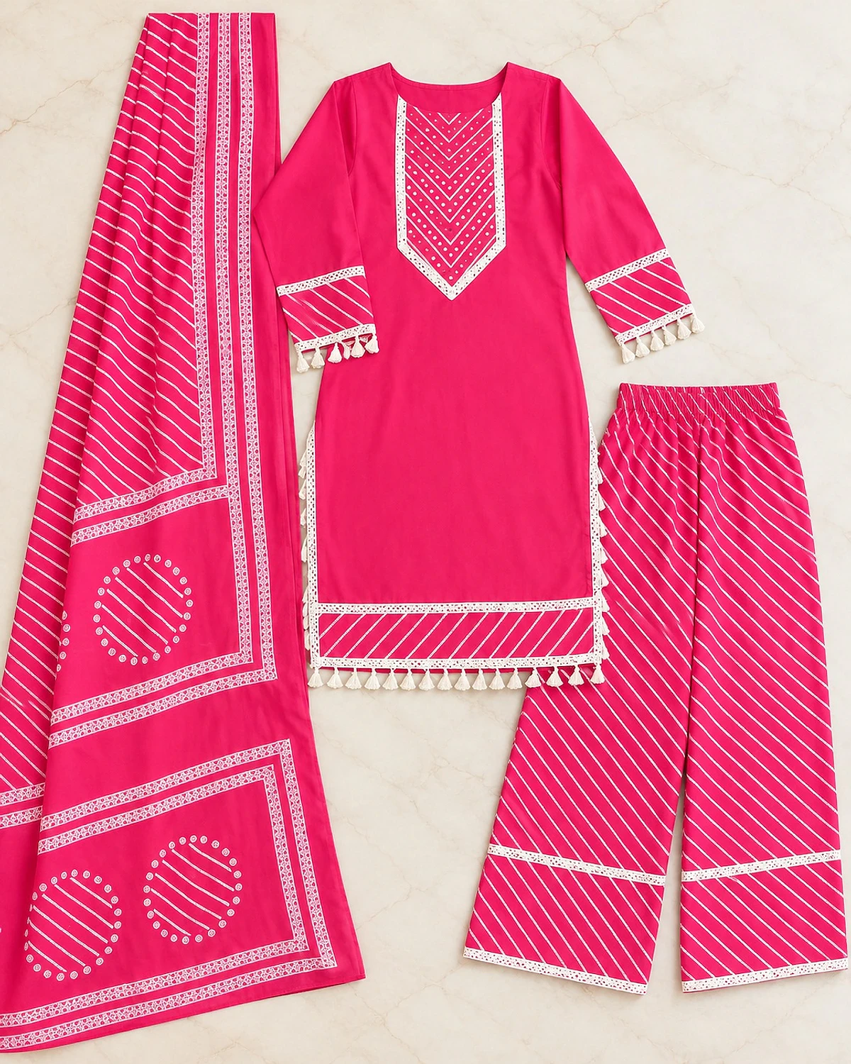 Pink kurta, trousers and dupatta laid out flat