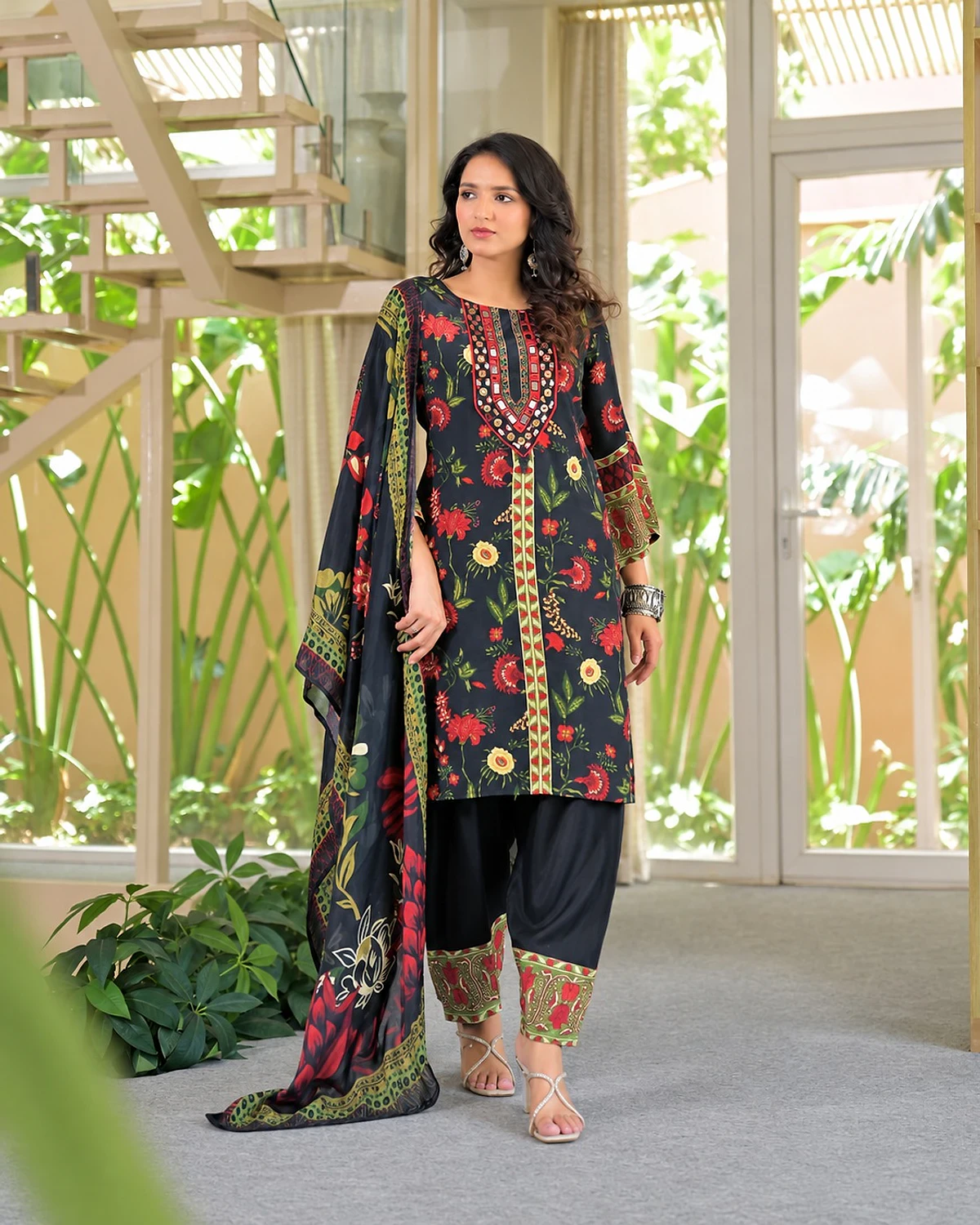 Woman wearing a black kurta, salwar and dupatta
