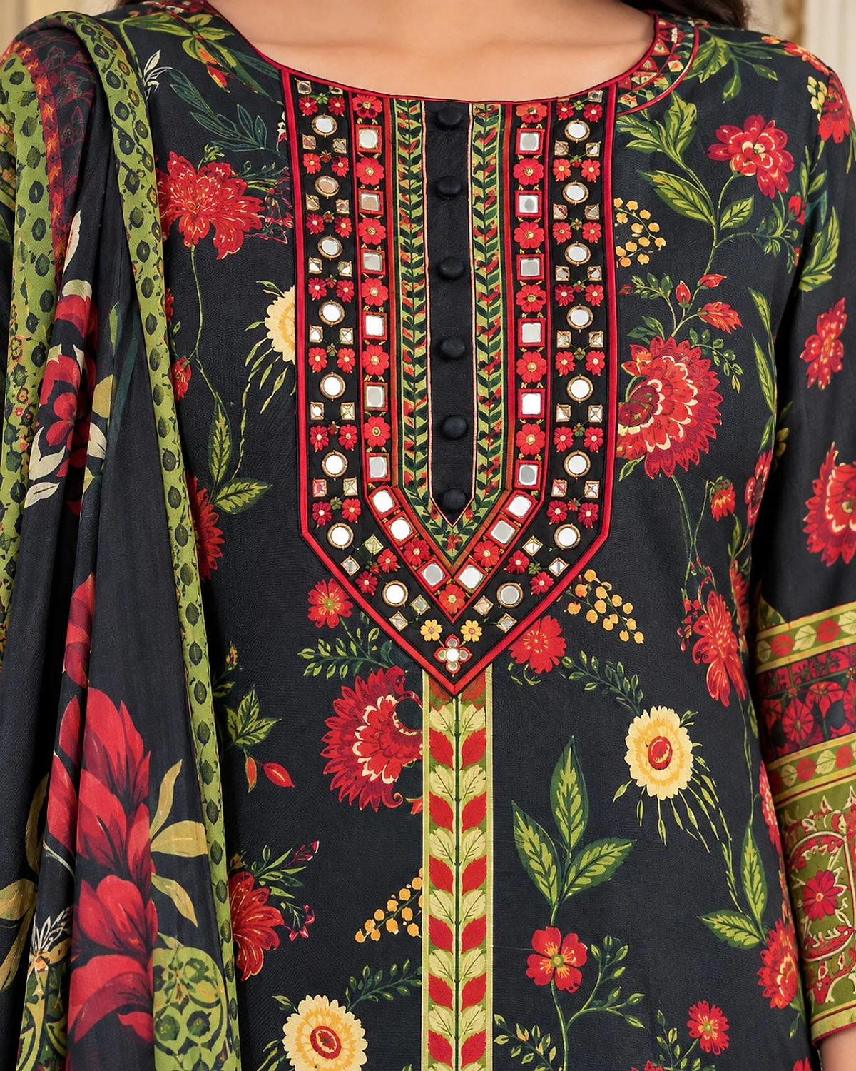 Close-up of the black kurta, showing a bold floral print and mirror-look yoke