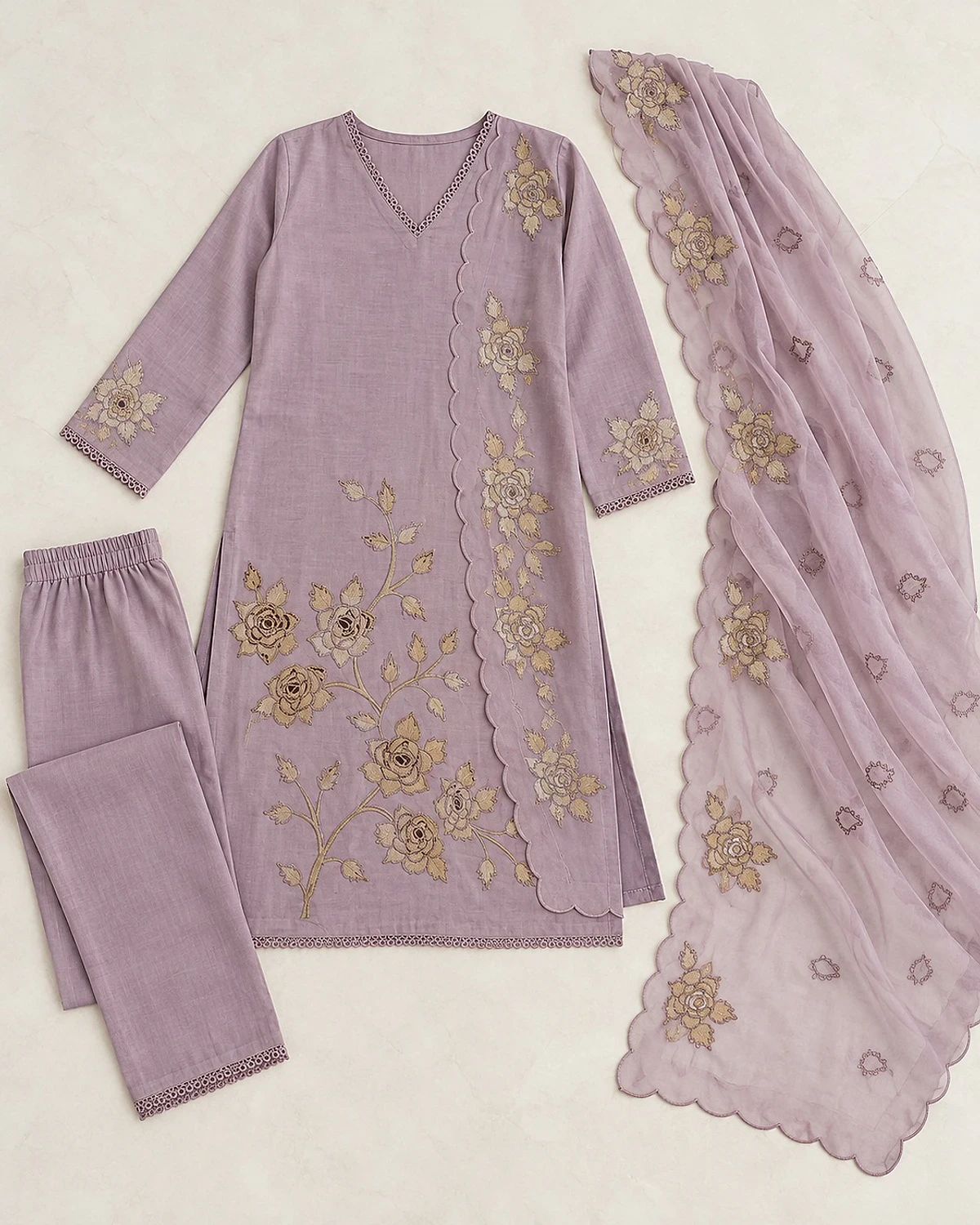 Mauve kurta, trousers and dupatta laid out flat
