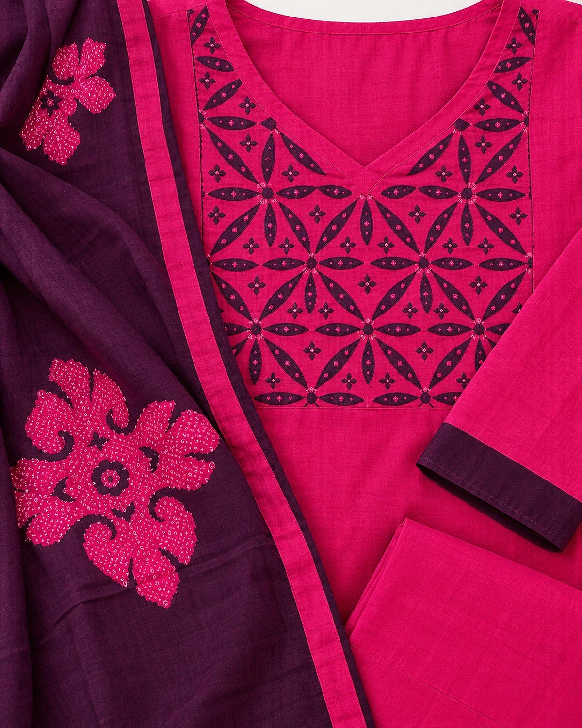 Close-up of the fuchsia kurta, showing a plum geometric yoke