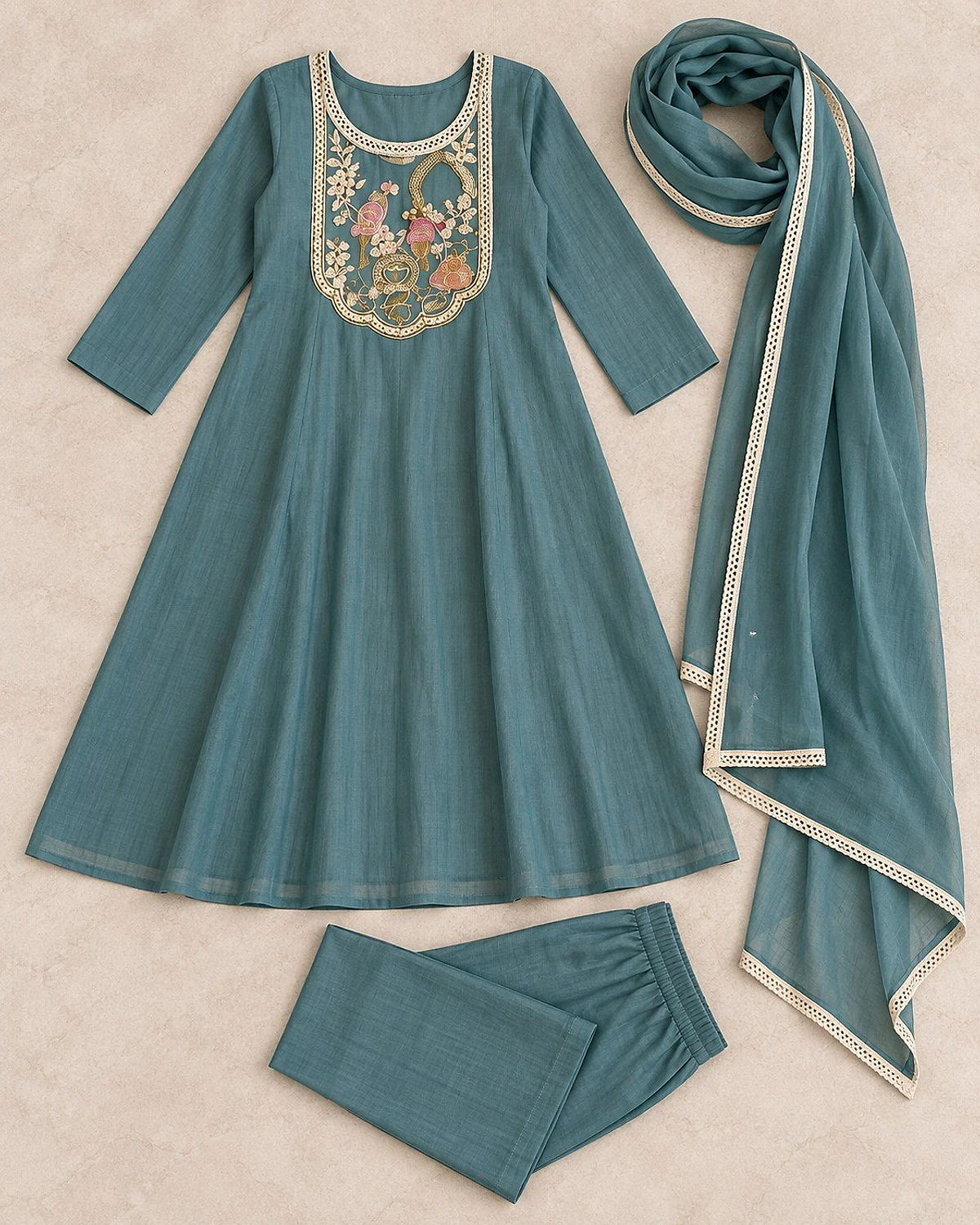 Turquoise kurta, trousers and dupatta laid out flat