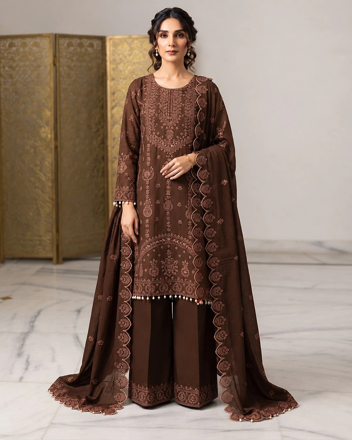 Woman wearing a coffee brown kurta, palazzo and dupatta