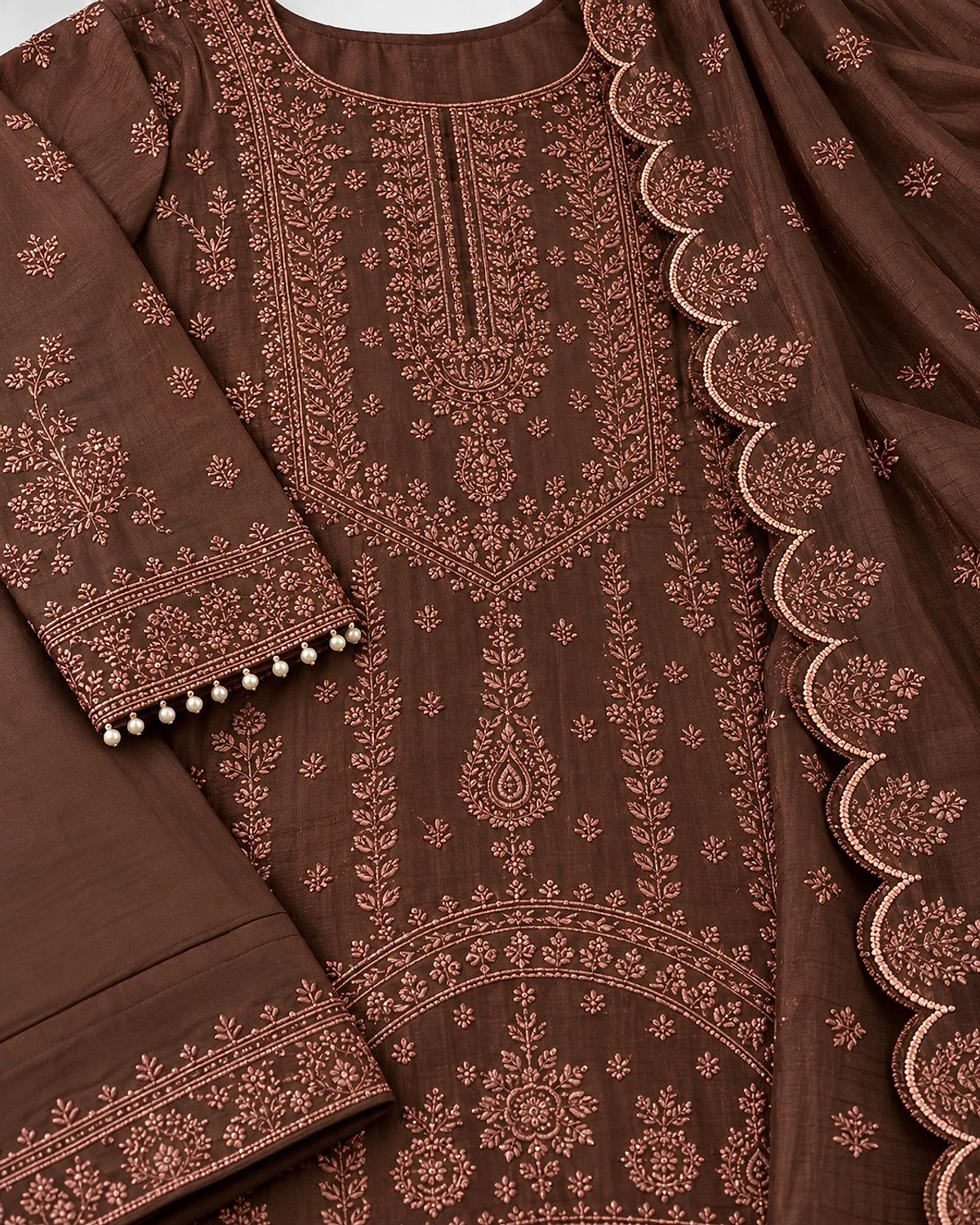 Close-up of the coffee brown kurta, showing fine tonal motifs and pearl-look drops