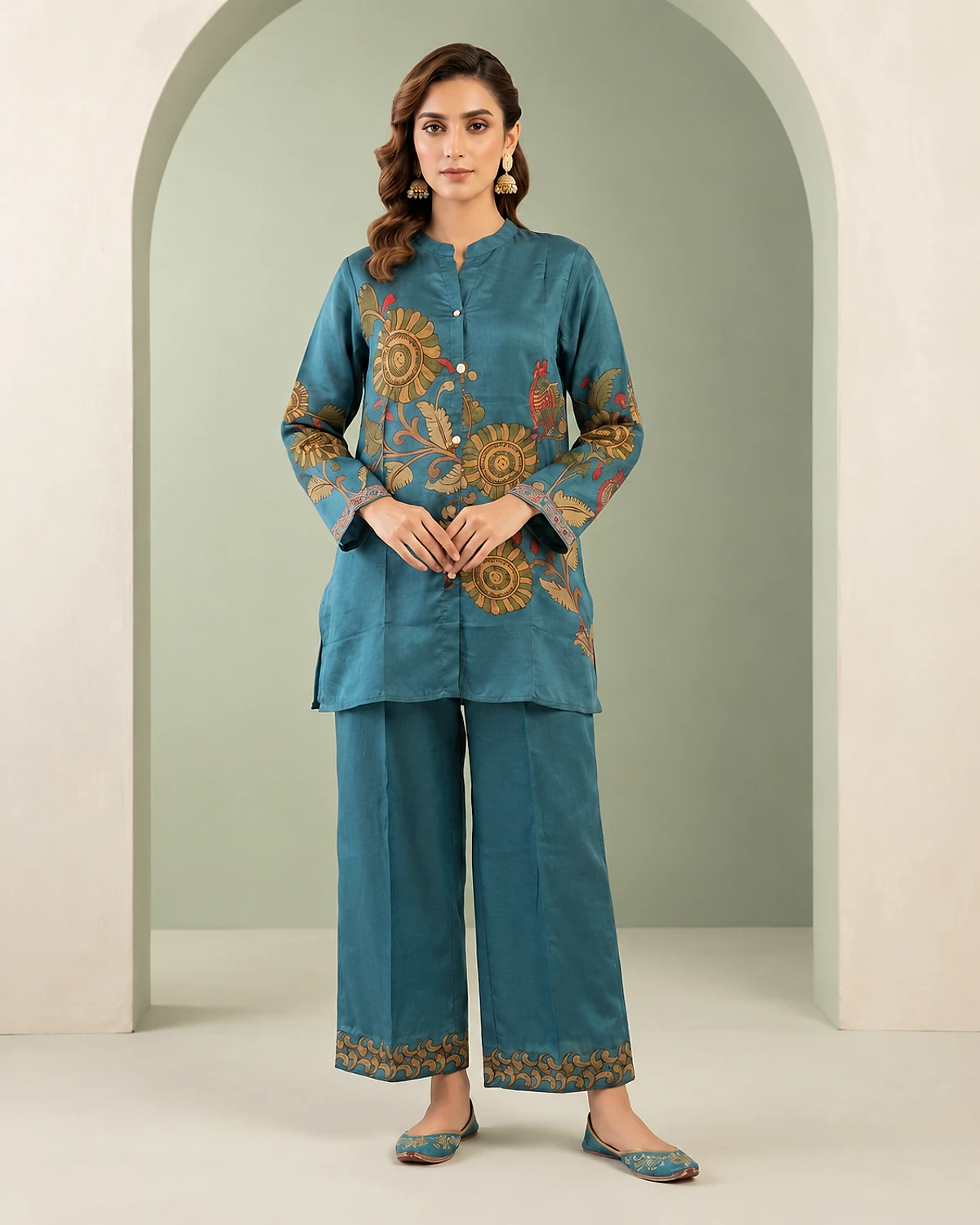 Woman wearing a blue floral print crepe tunic and palazzo