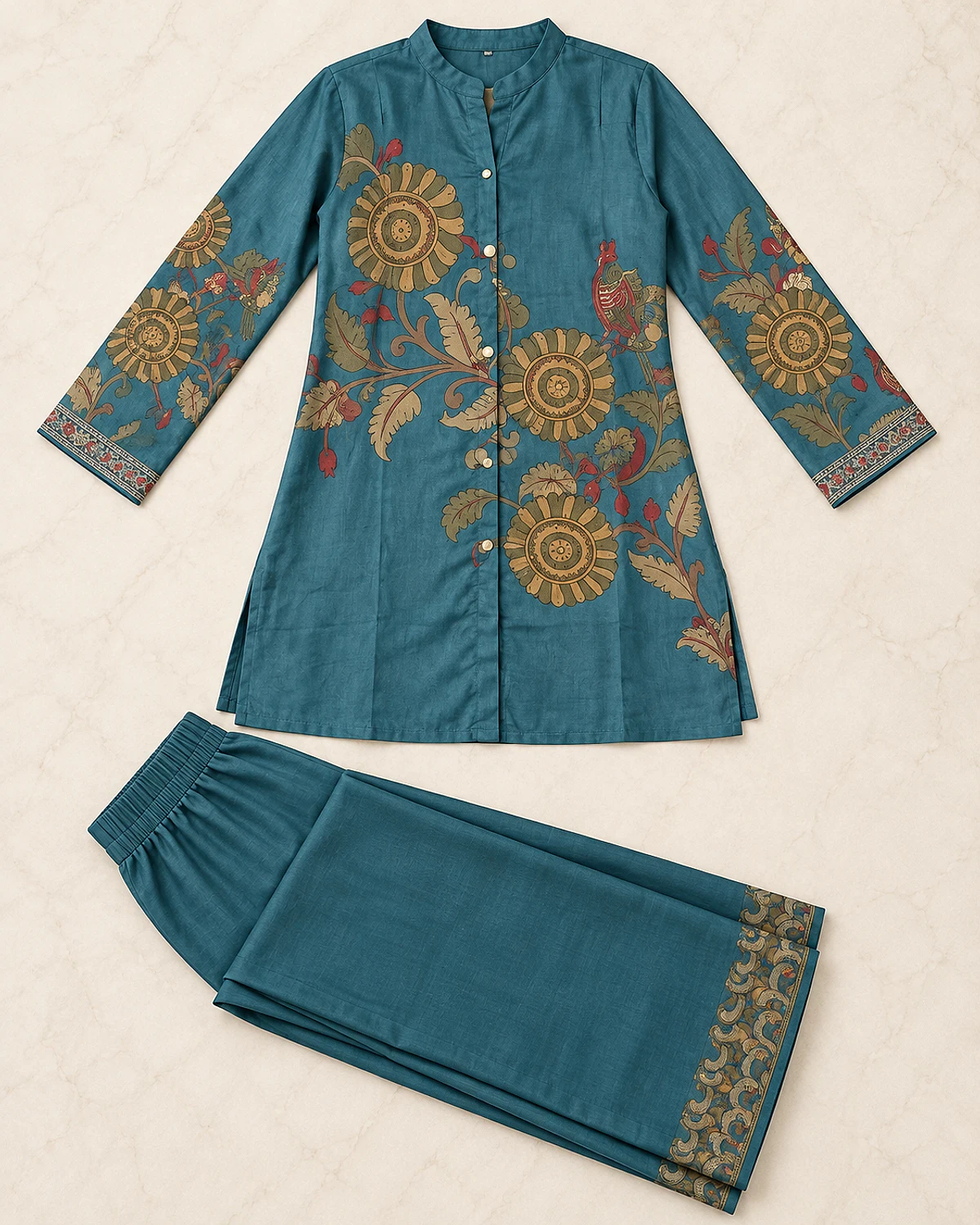 Blue floral print tunic and bordered palazzo laid out flat