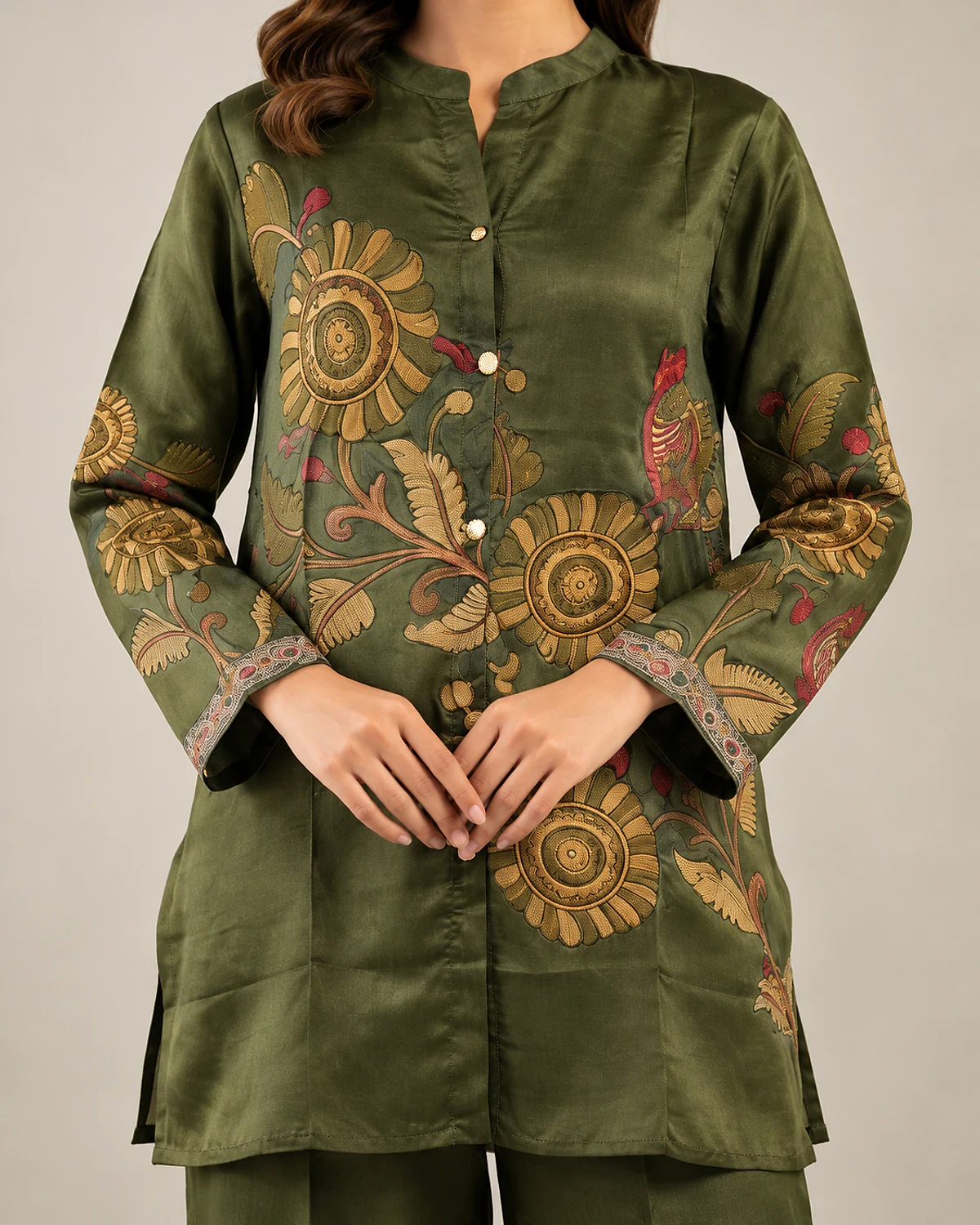 Close-up of the olive green tunic's floral print and button front