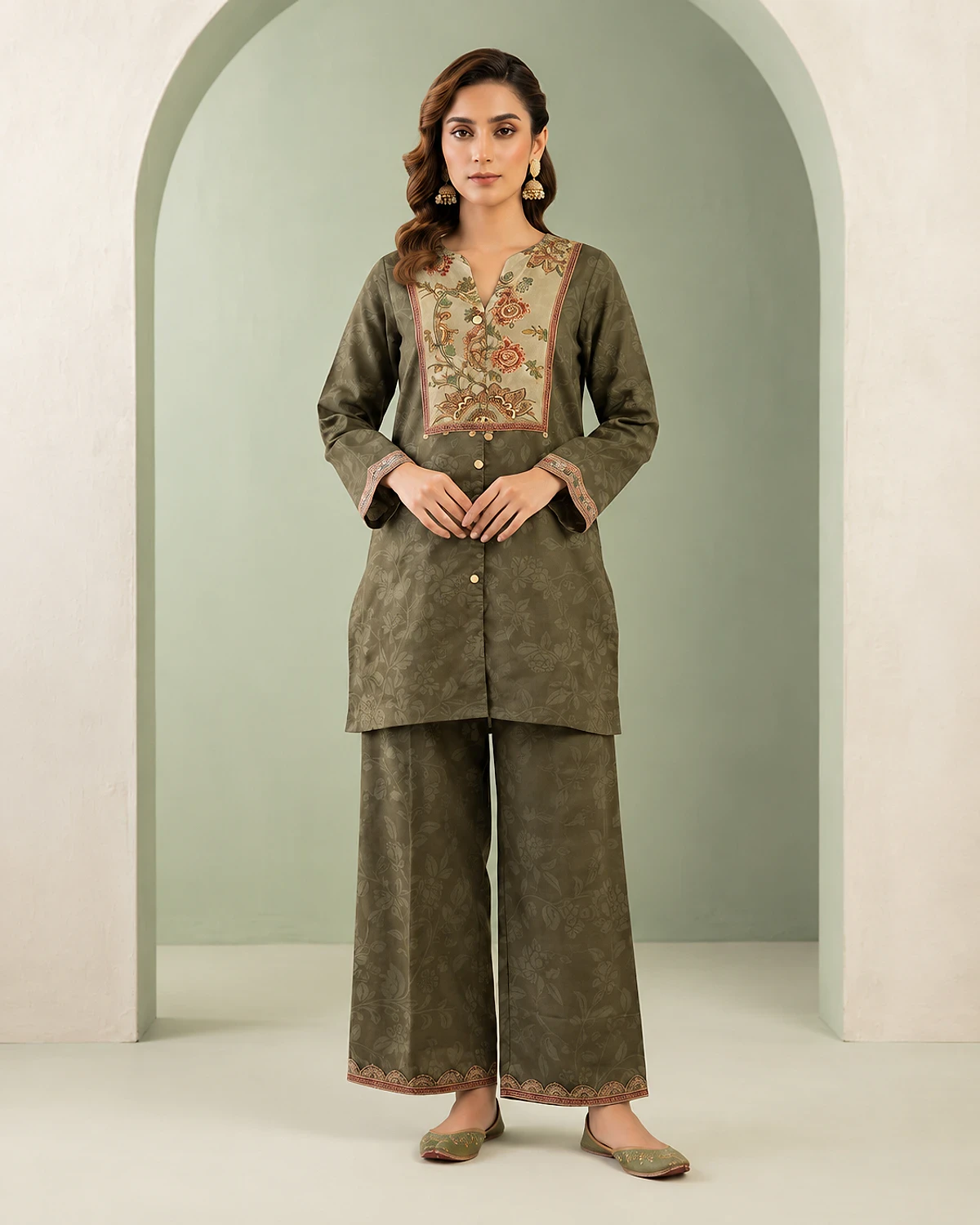Woman wearing a mehendi green crepe tunic with a floral yoke and palazzo