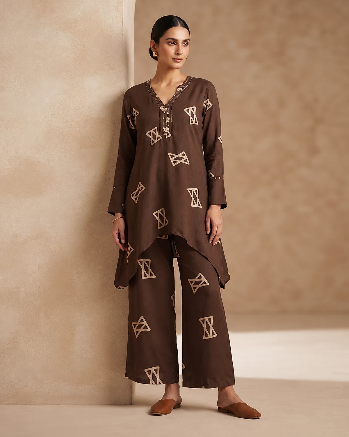Woman wearing a brown geometric print rayon kurta and palazzo
