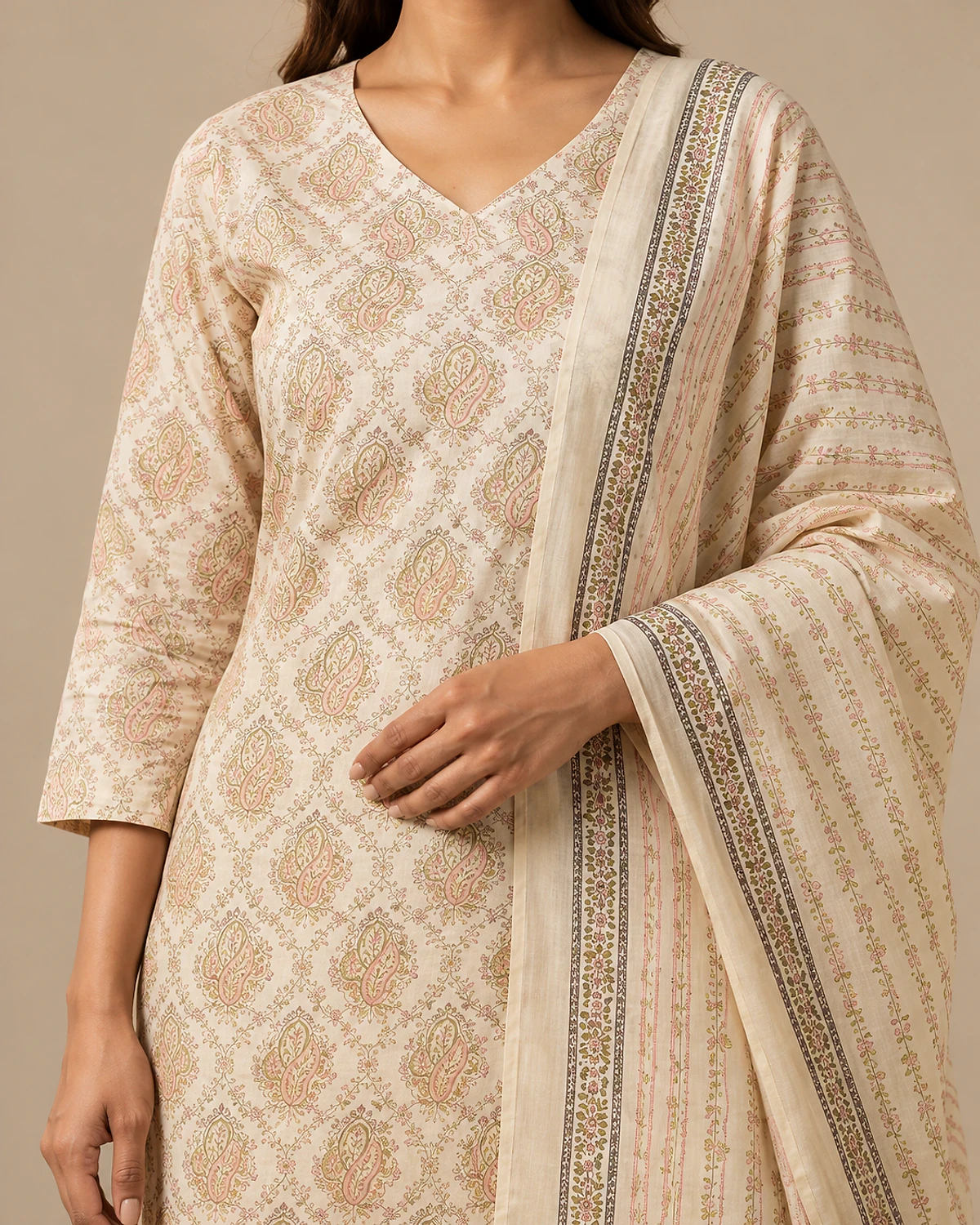 Close-up of the ivory kurta's paisley print and bordered dupatta