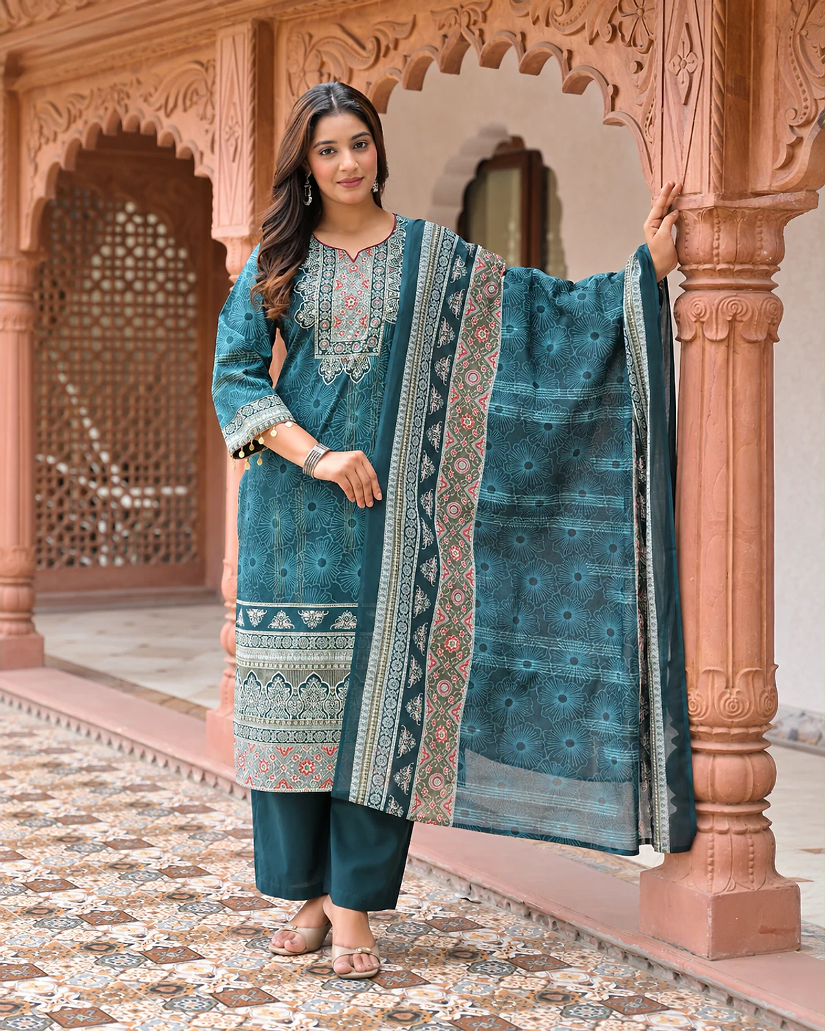 Woman wearing a teal printed cotton kurta, trousers and dupatta
