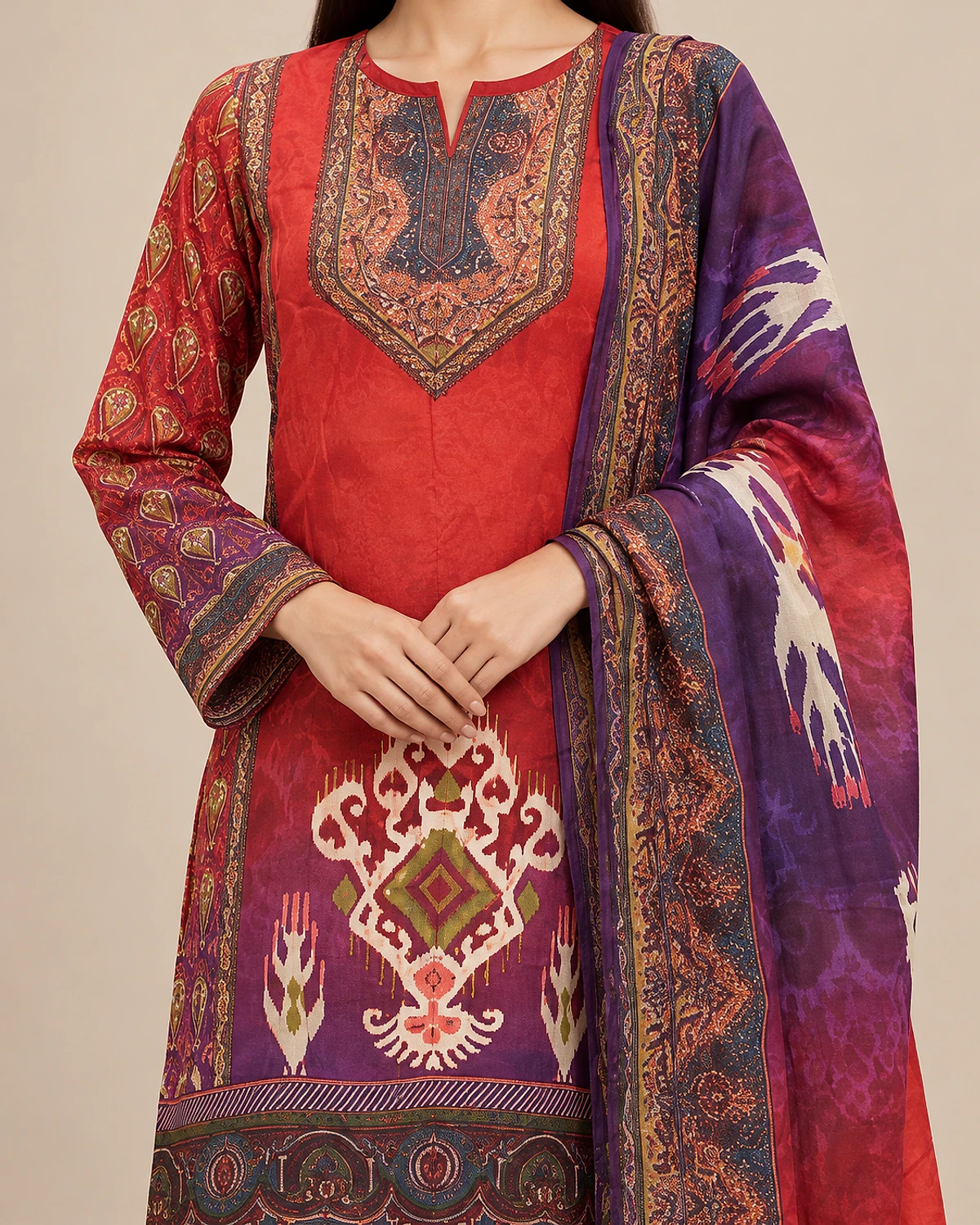 Close-up of the red kurta's printed yoke and ikat-style motif
