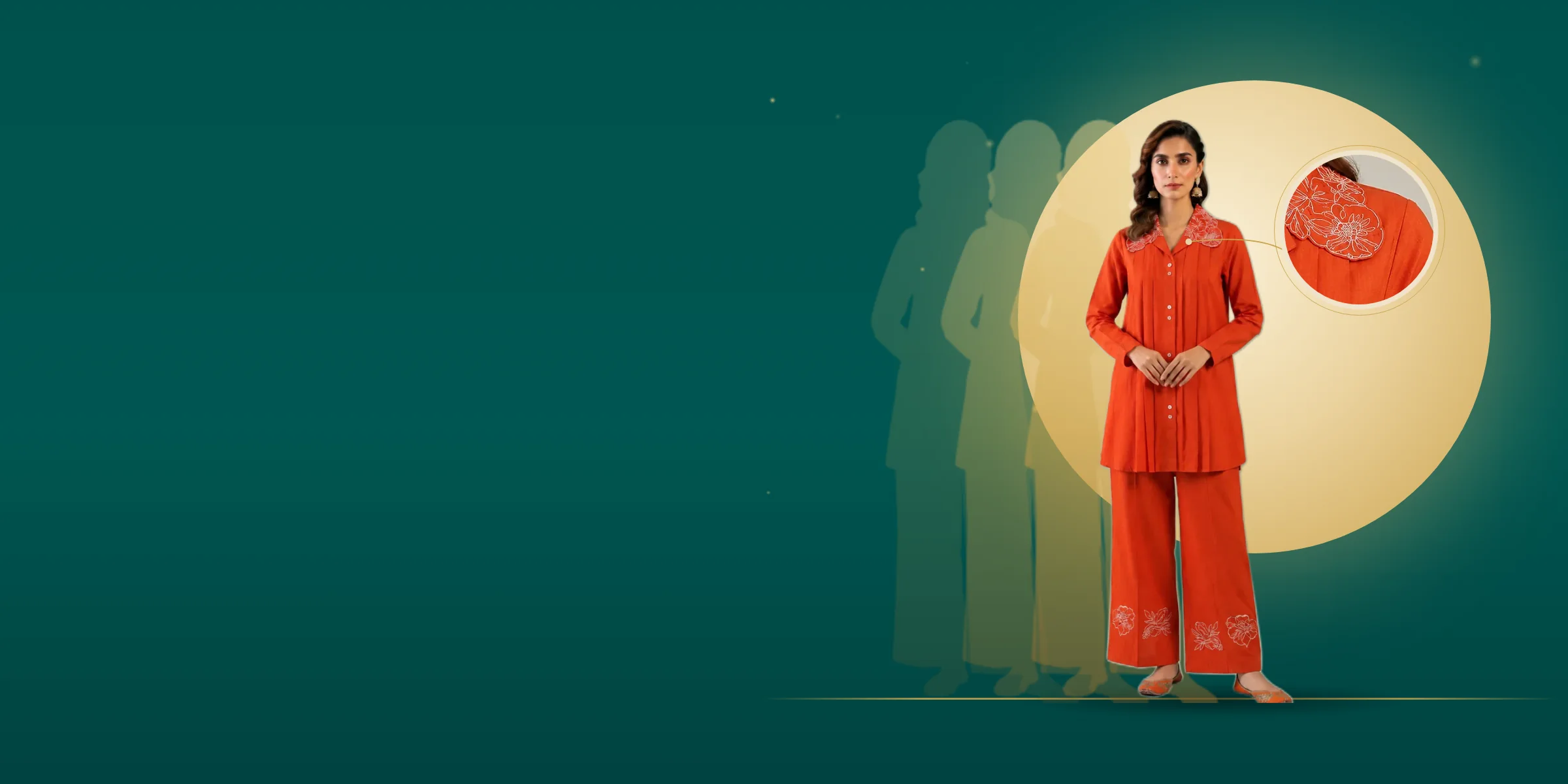 A woman in an orange cotton pintuck co-ord set with an embroidered collar